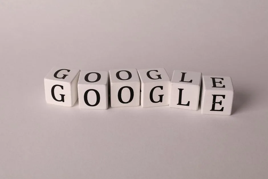 Photo by Ann H on Pexels White blocks with letters spelling Google, symbolizing search and SEO concepts.