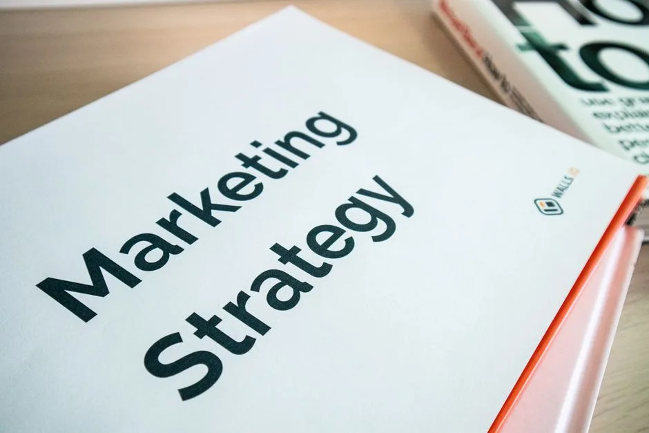 Photo by Walls.io on Pexels Close-up of a marketing strategy document on a desk, ideal for business content.