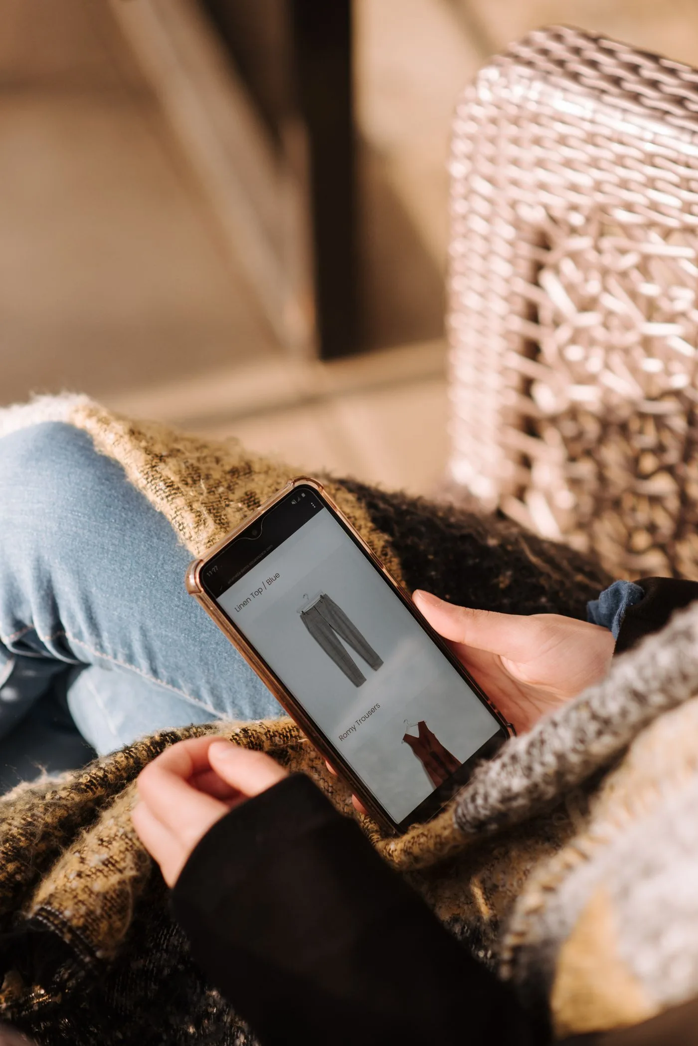Customer browsing fashion products for mobile checkout. Photo by Anete Lusina on Pexels