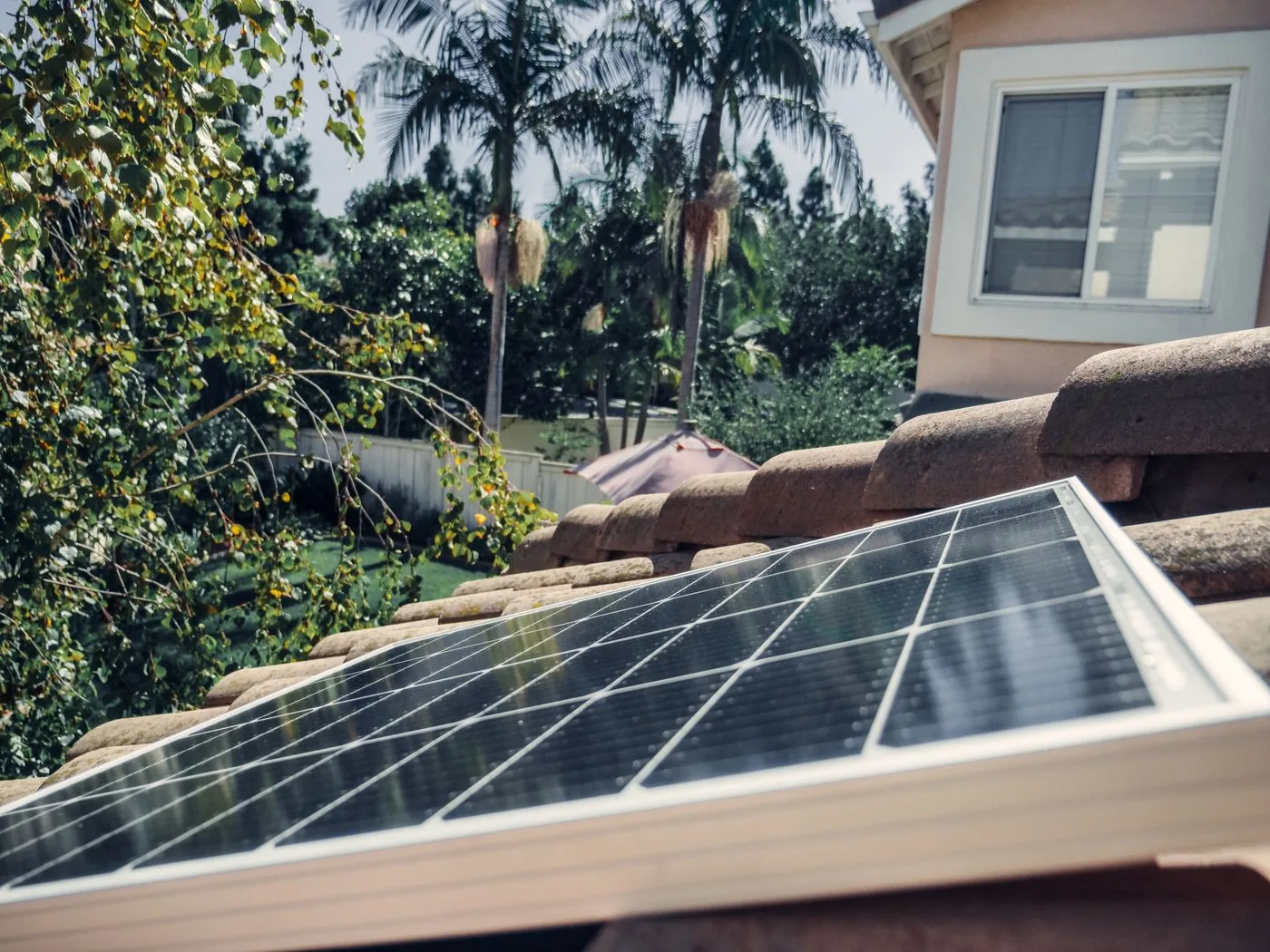 Residential rooftop solar panel installed on clay tiles. Photo by Kindel Media on Pexels