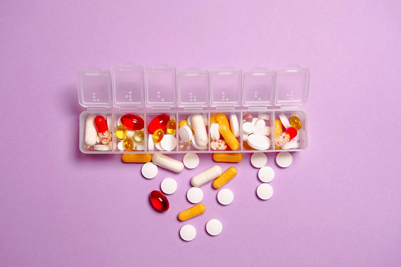 Weekly pill organiser with vitamins and supplements for daily routines. Photo by Anna Shvets on Pexels