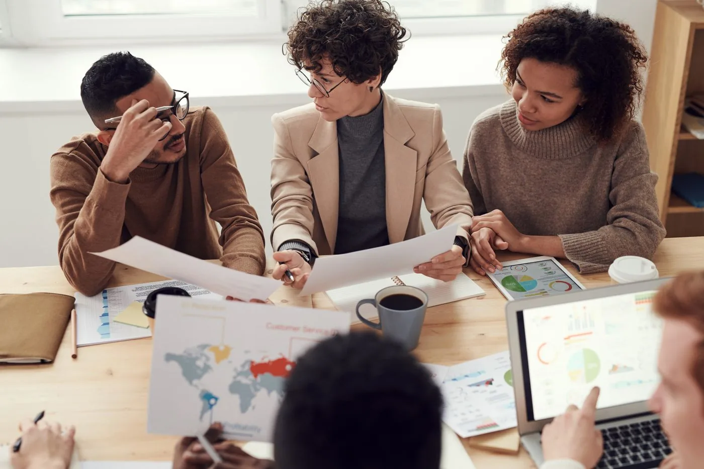 SaaS team mapping positioning on a whiteboard. Photo by fauxels on Pexels