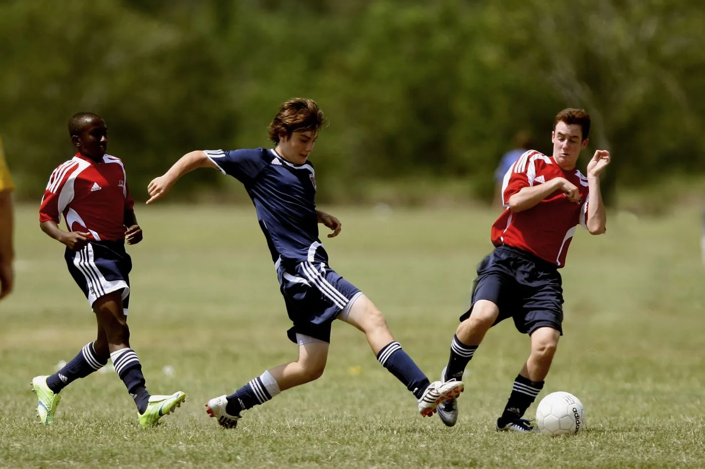 Local football players competing on a community pitch. Photo by Pixabay on Pexels