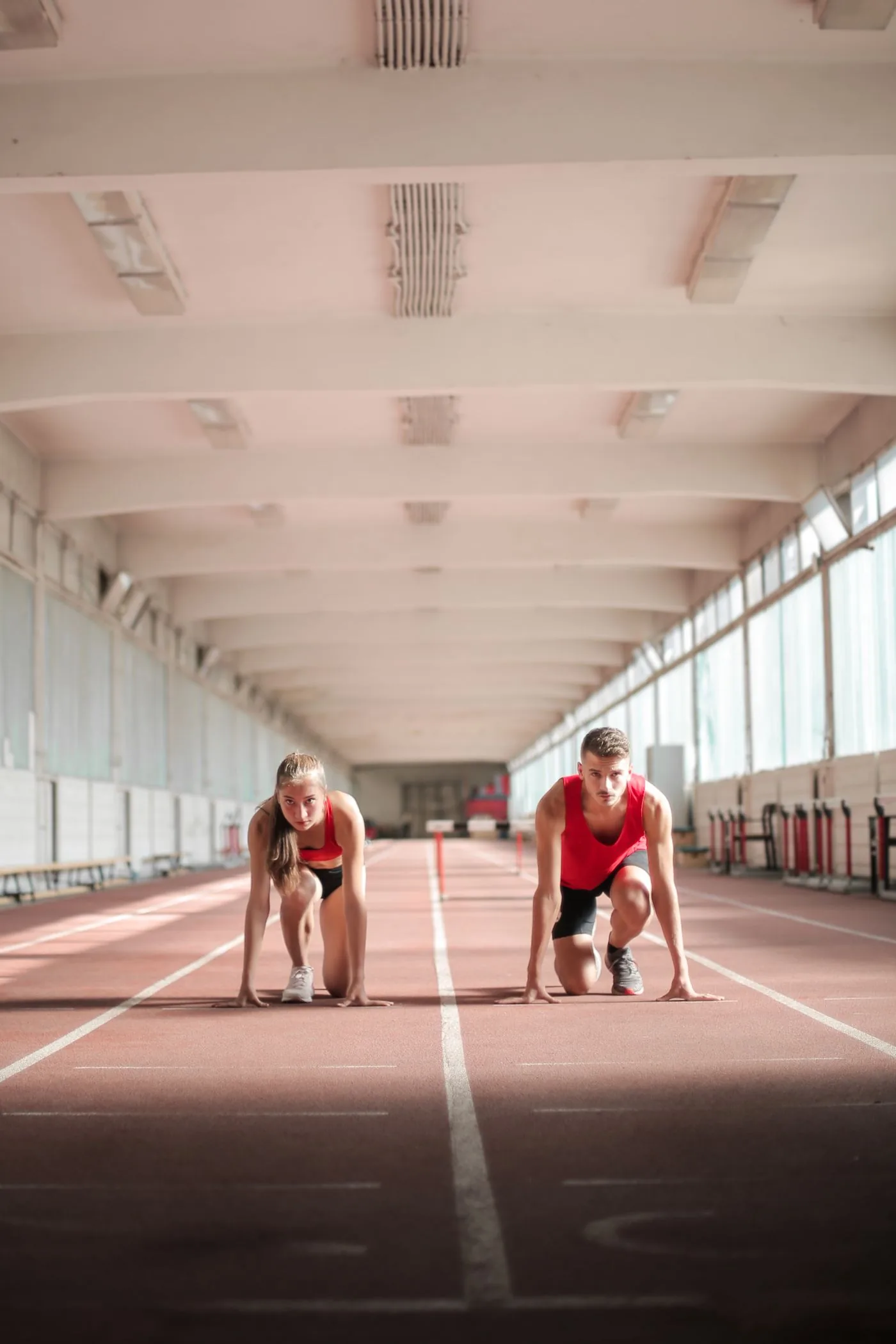 Two athletes ready to race representing an active sports community. Photo by Andrea Piacquadio on Pexels