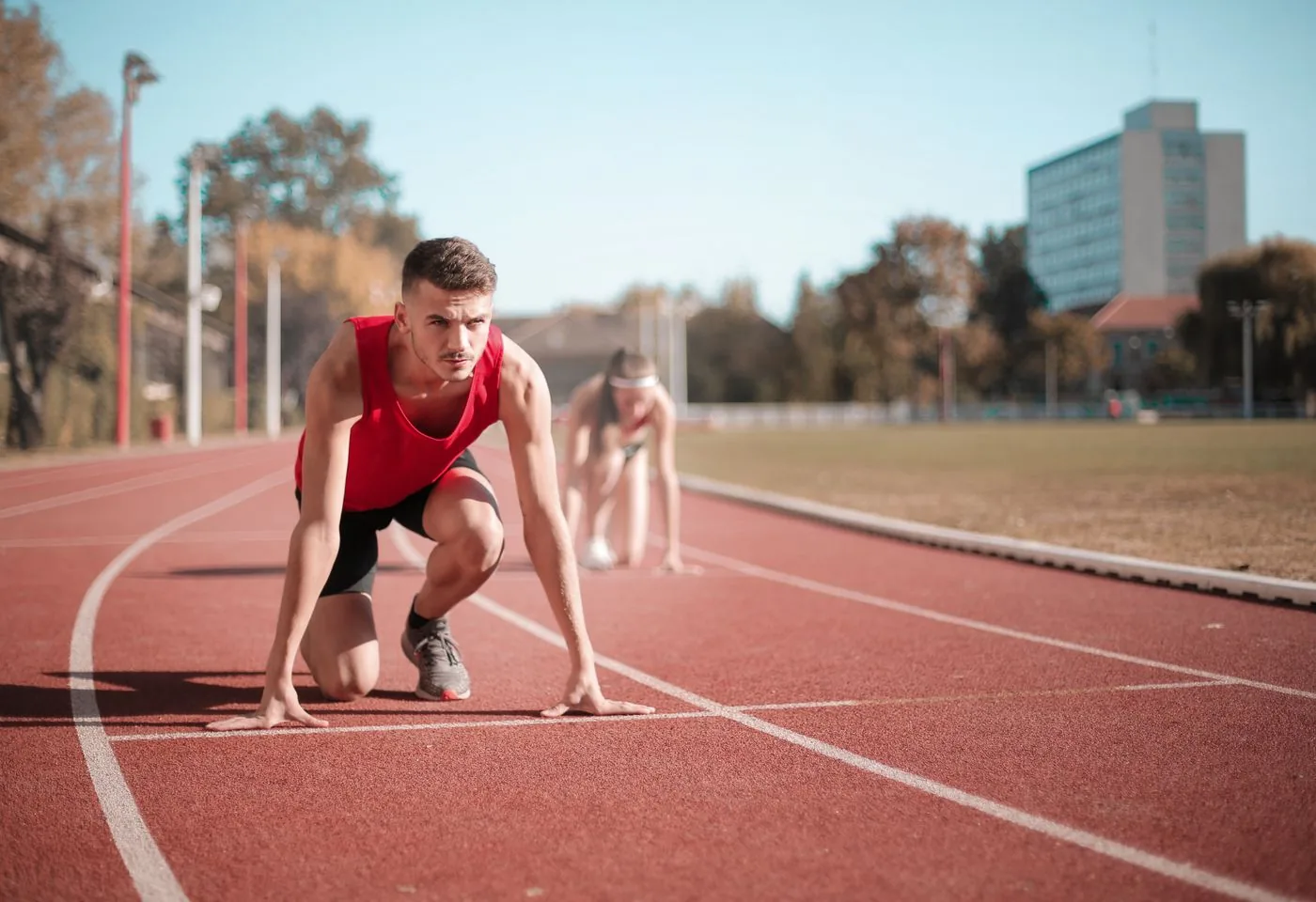 Runner at the starting line representing participation metrics. Photo by Andrea Piacquadio on Pexels