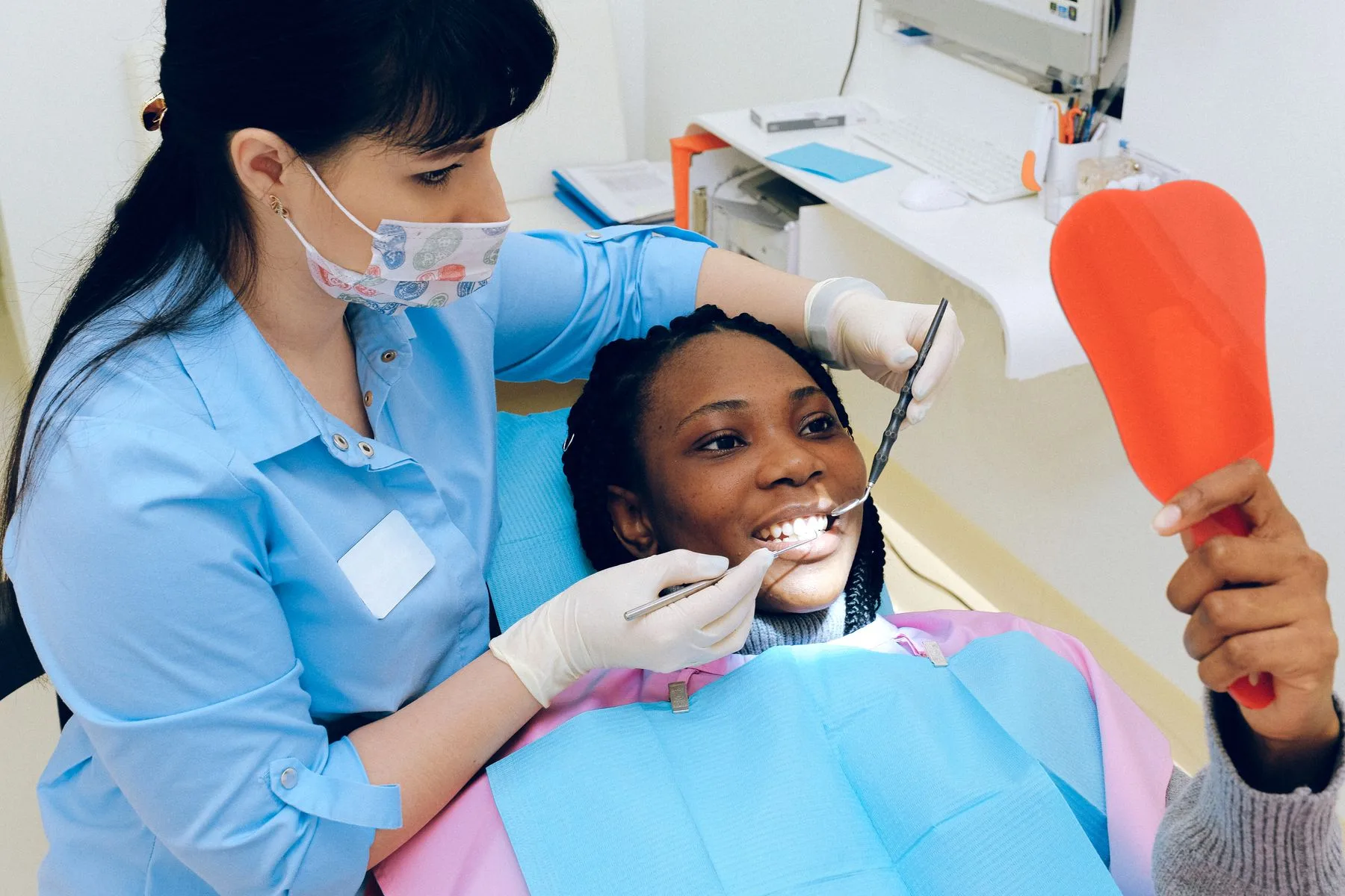 Dental professional ready for patient consultation. Photo by Anna Shvets on Pexels