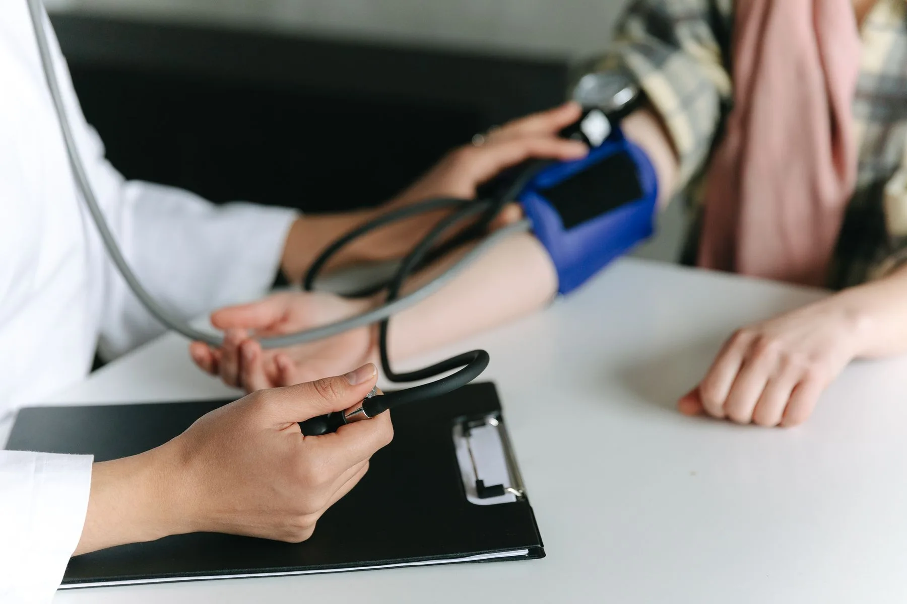 Practitioner reviewing skin treatment progress. Photo by Thirdman on Pexels