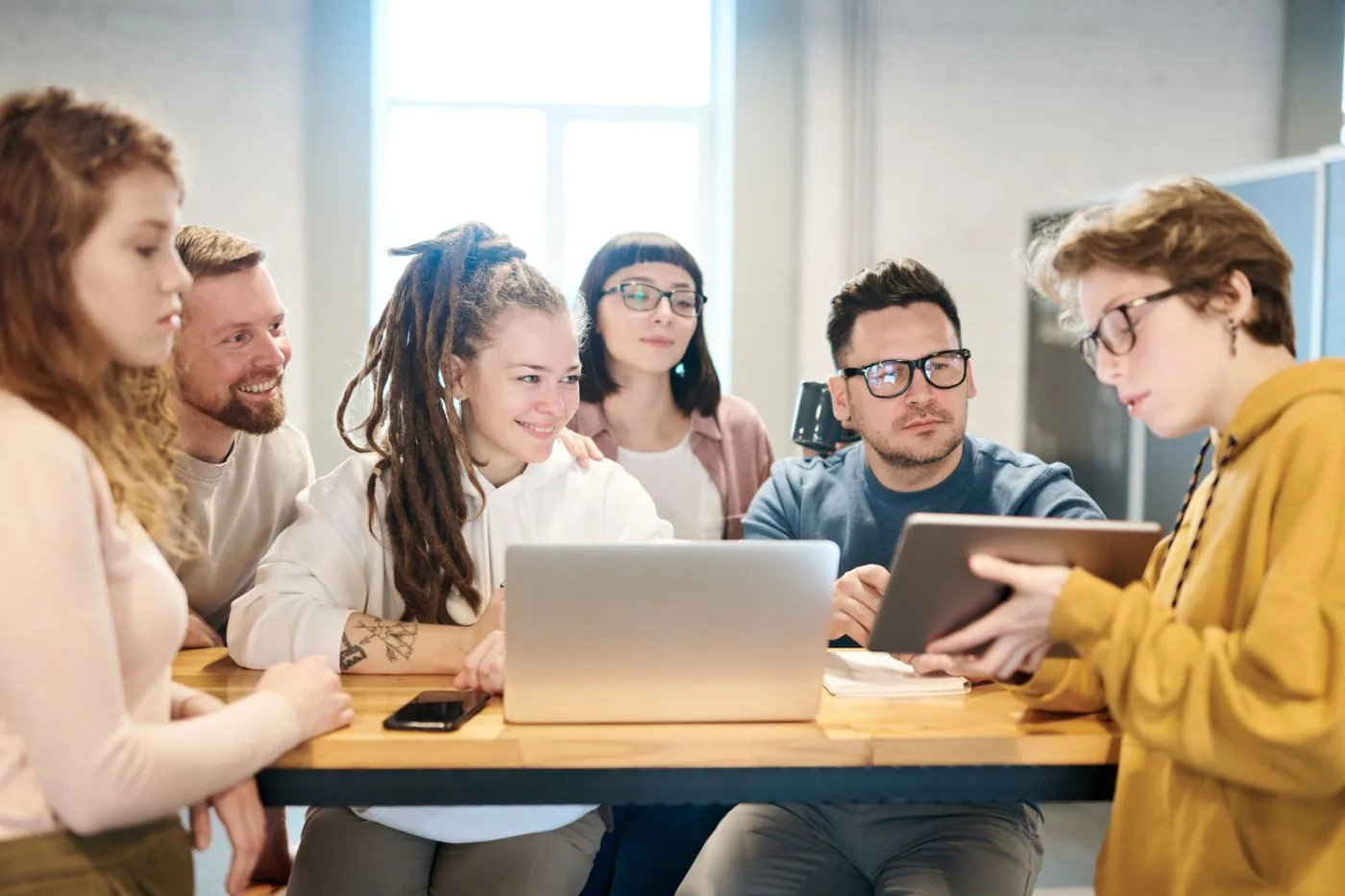 Team planning audience targeting around a meeting table