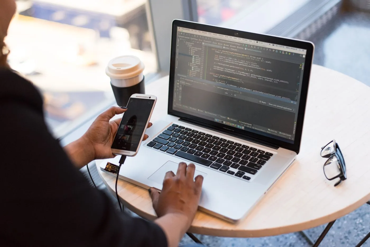 Person using a laptop and phone. Photo by Christina Morillo on Pexels